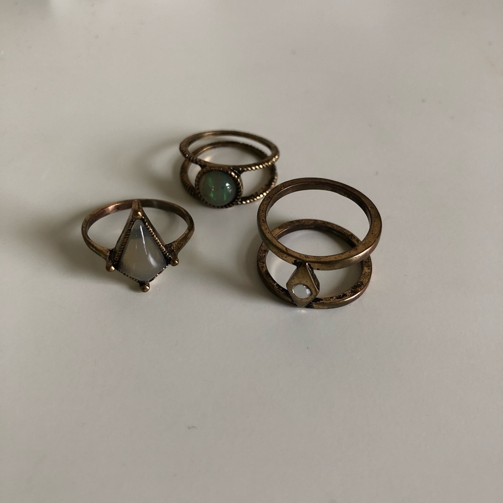 Three brass urban outfitters rings